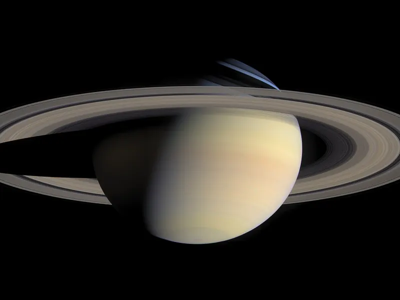 Saturn and its rings in natural colours, with the shadow of the planet falling across the rings