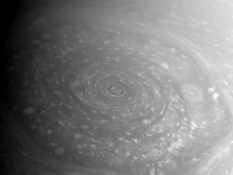 Saturn’s north pole seen from above: a six-sided pattern of cloud around a dark central storm