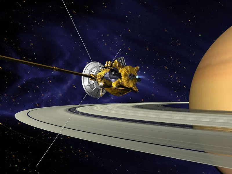 Artist’s impression of the Cassini spacecraft firing its engine just above Saturn’s rings