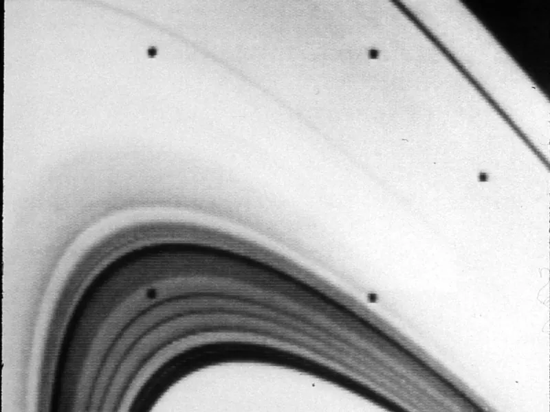 Saturn’s rings in close-up, in black and white: many thin bands with dark gaps between them
